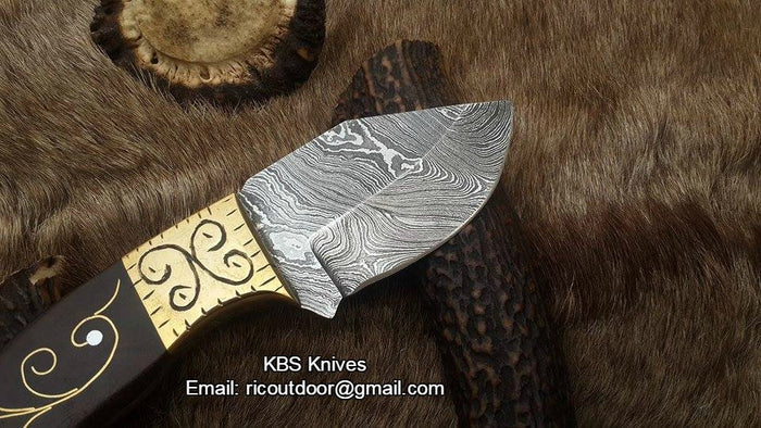 Custom handmade Skinner Blade with engraved Rosewood handle and Damascus steel blade.