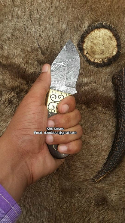 Custom Skinner Blade with leather sheath for easy portability and protection.